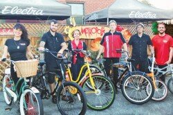 The award-winning team at Metropolis Bikes and a fleet of two-wheeled fun, ready for a holiday ride!